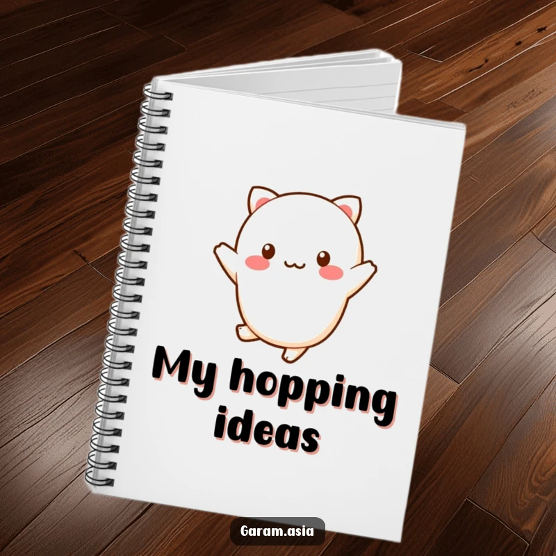 Funny kawaii wagashi character doing a cheerful little hop on the cover of a notebook.